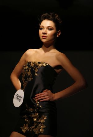 A model displays costume during the pre-show of World Boutique, Hong Kong in Hong Kong Convention and Exhibition Center, south China, Jan. 5, 2010.