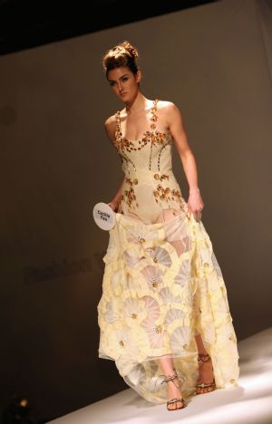 A model displays costume during the pre-show of World Boutique, Hong Kong in Hong Kong Convention and Exhibition Center, south China, Jan. 5, 2010. 