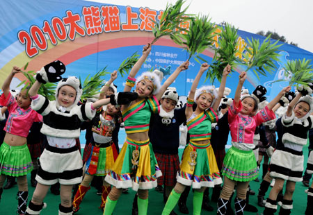 Children perform at the setting out ceremony for the ten giant pandas leaving for Shanghai at Bifeng Gorge Breeding Base of Sichuan in Ya&apos;an, southwest China&apos;s Sichuan Province, Jan. 5, 2010. The ten giant pandas, six females and four males selected by China Wolong Giant Panda Protection and Research Center, headed for Shanghai, host city of the 2010 World Expo, Tuesday on a chartered plane for a year-long display. [Chen Xie/Xinhua]