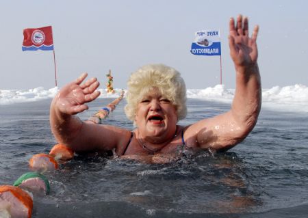 An enthusiast participates in a winter swimming competition in Vladivostok January 5, 2010. Russian ice swimmers, known as &apos;walruses&apos;, believe that their hobby helps to build up resistance to many illnesses and is crucial for surviving the long winter.[Xinhua/Reuters]