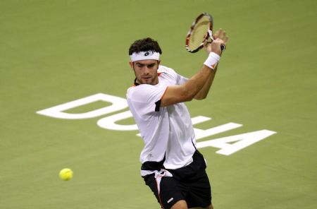 Simone Bolelli of Italy returns a shot to Spain's Rafael Nadal during the ATP Qatar Open tennis tournament in Doha January 5, 2010.