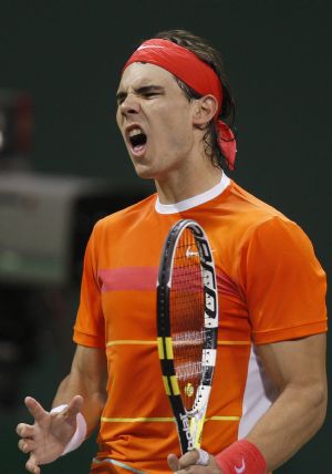 Spain's Rafael Nadal reacts after losing a point against Simone Bolelli of Italy during the ATP Qatar Open tennis tournament in Doha January 5, 2010.