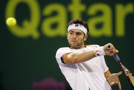 Simone Bolelli of Italy returns a shot to Spain's Rafael Nadal during the ATP Qatar Open tennis tournament in Doha January 5, 2010. 