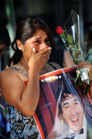 A fan of Argentine pop singer Sandro weeps outside the Congress building where his coffin is placed in Buenos Aires on Jan. 5, 2010. 