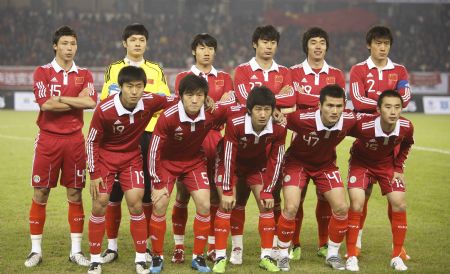 China's players pose for a group match before a Group D match of the Asian Cup 2011 Final Qualification Round against Syria in Hangzhou, east China's Zhejiang Province, Jan. 6, 2010.