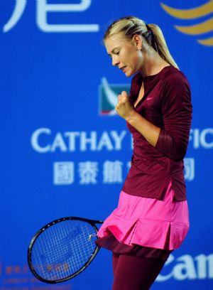 Team Russia's Maria Sharapova celebrates one point during the first round match of the Hong Kong Tennis Classic 2010 against China's Zheng Jie of Team Asia Pacific in Hong Kong of south China on Jan. 6, 2010. (Xinhua/Chen Duo)Team Russia's Maria Sharapova celebrates one point during the first round match of the Hong Kong Tennis Classic 2010 against China's Zheng Jie of Team Asia Pacific in Hong Kong of south China on Jan. 6, 2010.