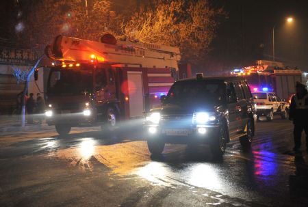 Picture taken on Jan. 7, 2010 shows fire engines arriving at a factory in which an explosion occured in Lanzhou, capital of northwest China's Gansu Province. The explosion broke out in the factory at about 5:30 p.m.. No casualties was reported.