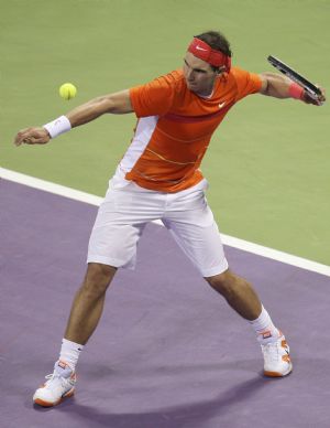 Spain's Rafael Nadal serves to Potito Starace of Italy during the ATP Qatar Open tennis tournament in Doha January 6, 2010. 