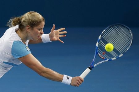 Belgium's Kim Clijsters hits a backhand against Germany's Andrea Petkovic during their women's singles semi-final match at the Brisbane International tennis tournament January 8, 2010.