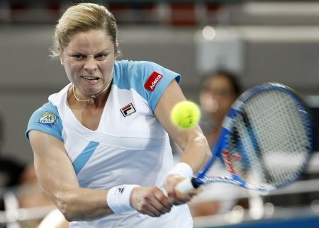 Belgium's Kim Clijsters hits a backhand against Germany's Andrea Petkovic during their women's singles semi-final match at the Brisbane International tennis tournament January 8, 2010.