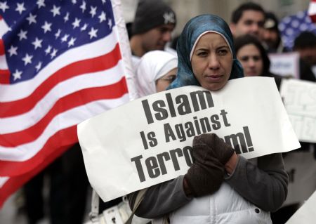 Arab-Americans hold signs saying 'Islam Is Against Terrorisim' as they demonstrate outside the Federal court building in Detroit, Michigan Jan. 8, 2010, during a hearing for Umar Farouk Abdulmutallab, the 23-year old Nigerian accused of attempting to blow up a Detroit bound jetliner. (Xinhua/Reuters Photo) 