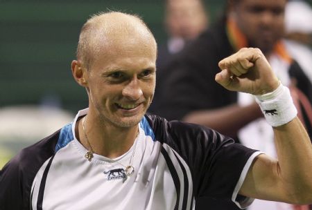 Russia's Nikolay Davydenko celebrates after defeating Spain's Rafael Nadal during the final match at the ATP Qatar Open tennis tournament in Doha January 9, 2010. 