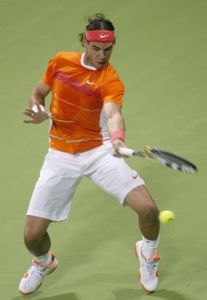 Spain's Rafael Nadal returns a shot to Nikolay Davydenko of Russia during the final match of the ATP Qatar Open tennis tournament in Doha January 9, 2010. 