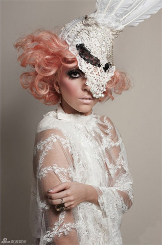Lady Gaga sports an avant-garde grace style in fresh smoke-eye makeup and a delicate veil gown on the cover of 944 magazine's 2010 January issue.