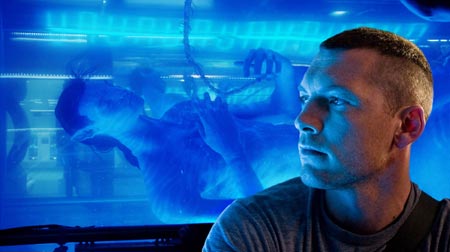 Actor Sam Worthington, who portrays the character Jake, gets a first look at his avatar, a human-alien hybrid bred from Jake's own DNA, in this undated publicity photograph from a scene in director James Cameron's new film 'Avatar.' 