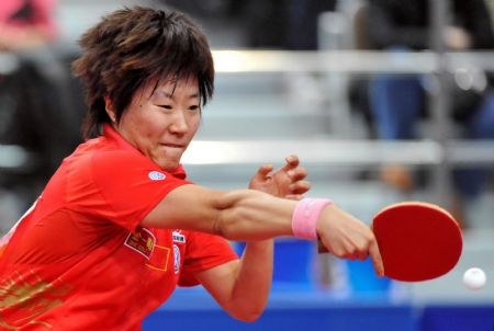 Guo Yan of China returns the ball to her compatriot Ding Ning during the women's singles final at the International Table Tennis Federation (ITTF) Pro Tour Grand Finals in Macao, south China, on Jan. 10, 2010. Guo claimed the title of the event after beating Ding by 4-3. (Xinhua/Lo Ping Fai)