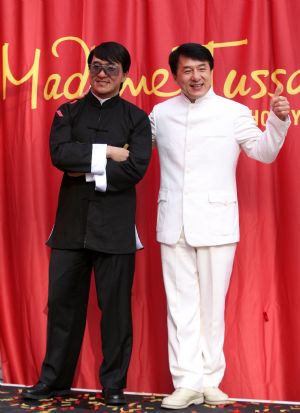 Actor Jackie Chan poses next to a wax figure of himself during the unveiling of the figure at Madame Tussauds Hollywood in Los Angeles on Monday, Jan. 11, 2010.