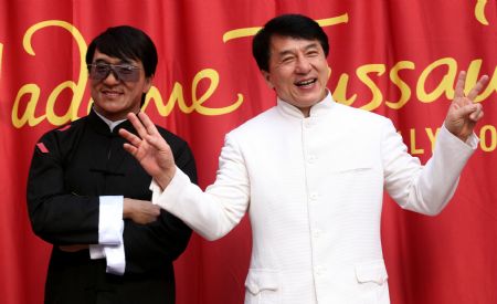 Actor Jackie Chan poses next to a wax figure of himself during the unveiling of the figure at Madame Tussauds Hollywood in Los Angeles on Monday, Jan. 11, 2010.