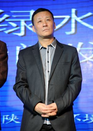 Film director Liang Zi turns up at the press meeting on publicity of the Green Water, a new movie on the theme of environmental protection which is scheduled for public premiere as of March 2010, in Beijing, Jan. 10, 2010.