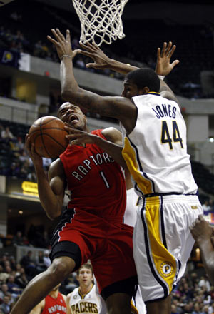 Toronto Raptors guard Jarrett Jack (1) looks to score underneath the basket against Indiana Pacers forward Solomon Jones during the second quater of their NBA basketball game in Indianapolis January 11, 2010.