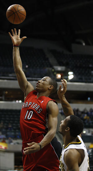 Toronto Raptors guard DeMar DeRozan (10) shoots the basketball while guarded by Indiana Pacers guard Luther Head during the first quarter of their NBA basketball game in Indianapolis January 11, 2010. 