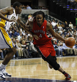 Toronto Raptors forward Chris Bosh (R) drives into the lane guarded by Indiana Pacers forward Solomon Jones during the second quarter of their NBA basketball game in Indianapolis January 11, 2010. 