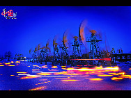 Daqing Field,is the largest oil field in China, located between the Songhua river and Nunjiang river in Heilongjiang province. Discovered in 1959 by Li Siguang. Wang Jinxi (known as 'Iron man' Wang, who led No. 1205 drilling team), this field has produced over 10 billion barrels (1.6 km3) of oil since production started in 1960. [Photo by Liu Xingguo]