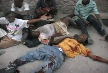 Earthquake victims lie on the ground in Port-au-Prince in this January 12, 2010 video grab.[Xinhua/Reuters] 