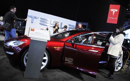 Tesla's luxious Model S hybrid car is presented during the second press preview day of the 2010 North American International Auto Show (NAIAS) at Cobo center in Detroit, Michigan, U.S.A., Jan. 12, 2010. [Xinhua]