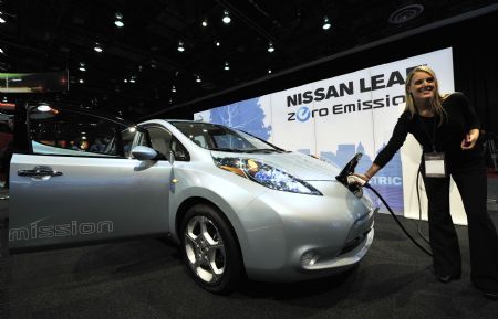 A model presents Nissan's Zero Emission electric car at the Electric Avenue during the second press preview day of the 2010 North American International Auto Show (NAIAS) at Cobo center in Detroit, Michigan, U.S.A., Jan. 12, 2010. [Xinhua]