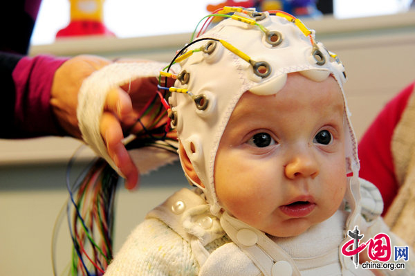 4-month-old Matai Reid takes part in research by Durham University at the Stockton-on-Tees campus to study the development of babies brains and to try and get a better understanding of how autism might occur. [CFP]