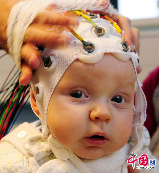 4-month-old Matai Reid takes part in research by Durham University at the Stockton-on-Tees campus to study the development of babies brains and to try and get a better understanding of how autism might occur. [CFP]