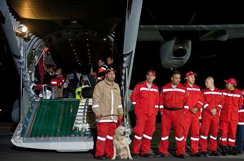 The first group of Mexican disaster relief personnel along with sniffer dogs prepare to depart Mexico city for Haiti on January 13, 2010. Rescuers, sniffer dogs, equipment and supplies headed to Haiti by air and sea in a global response to a horror earthquake feared to have killed more than 100,000 people. [Xinhua/AFP]