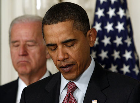 U.S. President Barack Obama makes remarks about the devastation caused by an earthquake in Haiti as Vice President Joe Biden listens at the White House in Washington January 13, 2010. Obama said he had ordered the U.S. government to provide fast, coordinated help to save lives, saying military overflights had already begun assessing damage, emergency supplies were being sent and search and rescue teams would be arriving on Wednesday and Thursday.(Xinhua/Reuters Photo)