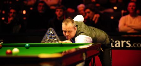 Three-time World champion John Higgins of Scotland competes in the Wembley Masters Snooker against Mark Allen of Northern Ireland at the Wembley Arena in London on Jan. 13, 2010.