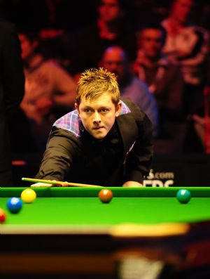 Mark Allen of Northern Ireland competes in the Wembley Masters Snooker against three-time World champion John Higgins of Scotland at the Wembley Arena in London on Jan. 13, 2010.