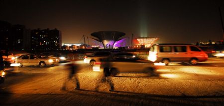 Photo taken on Jan. 12, 2010 shows the scenery of the Expo Axis and China Pavilion during a trial illumination in the Expo Park in Shanghai, east China.(Xinhua Photo)