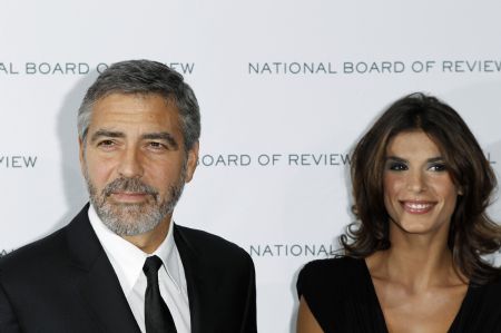 Actor George Clooney arrives with Elisabetta Canalis to accept the award for Best Actor for his work in 'Up In The Air' at the National Board of Review Award ceremony in New York January 12, 2010. 