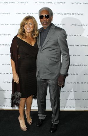 Actor Morgan Freeman arrives with an unidentified guest to accept the award for Best Actor for his work in the film Invictus at the National Board of Review Award ceremony in New York January 12, 2010.