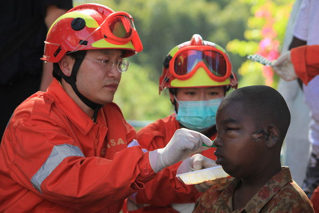 The Chinese emergency rescue team arrived in Haiti's capital Port-au-Prince early Thursday local time, Jan.14 to help the rescue operation after an earthquake in which up to 100,000 people are feared dead and eight Chinese are still missing. [Xinhua]