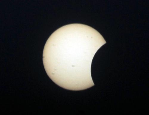 People across China turned their eyes skyward Friday, Jan. 15, when daylight faded as the sun changed into blazing ring surrounding a dim disk Friday afternoon. [Xinhua]