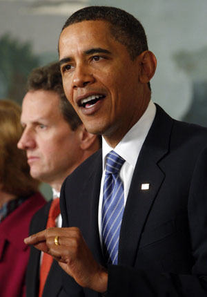U.S. President Barack Obama (R) makes remarks urging Wall Street to roll back executive bonuses as he proposed a fee to repay taxpayers for a financial bailout as Treasury Secretary Timothy Geithner listens at the White House in Washington, January 14, 2010.