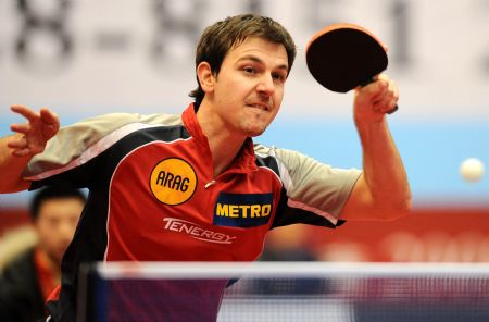Shakehand player, Germany's Timo Boll returns a shot against China's Ma Lin, a Penhold player, during a table tennis charity competition between the Shakehand team and the Penhold team in Chengdu, capital of Southwest China's Sichuan Province, Jan. 14, 2010. (Xinhua/Chen Kai) 