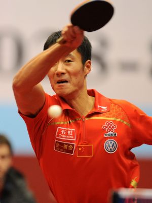 Shakehand player, China's Wang Liqin returns a shot against South Korea's Rye Seung-min, a Penhold player, during a table tennis charity competition between the Shakehand team and the Penhold team in Chengdu, capital of Southwest China's Sichuan Province, Jan. 14, 2010.