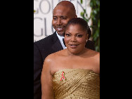 Nominated for Best Performance by an Actress in a Supporting Role in a Motion Picture for her role in 'Precious', actress Mo'nique with actor Sidney Hicks attend the 67th Annual Golden Globes Awards at the Beverly Hilton in Beverly Hills, CA Sunday, January 17, 2010. [HFPA/China.org.cn] 