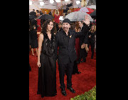 The Edge arrives with a guest at the 67th Annual Golden Globe Awards at the Beverly Hilton in Beverly Hills, CA Sunday, January 17, 2010. [HFPA/China.org.cn] 