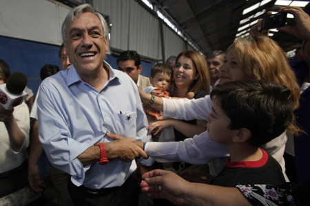 Sebastian Pinera, presidential candidate for Chile's right-wing opposition, took the nation's presidency with 51.8 percent of the vote in Sunday's second round election.