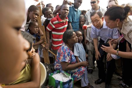 In this photo provided by the U.N., United Nations Secretary General Ban Ki Moon speaks with displaced Haitians during his trip to Port au Prince, Haiti on Sunday Jan. 17, 2010.
