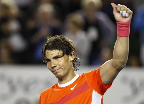 Rafael Nadal of Spain greets the spectators after the first round match of men's singles against Peter Luczak of Australia during 2010 Australian Open in Melbourne, Australia, Jan. 18, 2010. (Xinhua/Wang Lili)