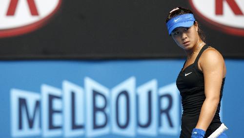 Han Xinyun of China reacts during the first round match of women's singles against Samantha Stosur of Australia in 2010 Australian Open at Rod Laver Arena in Melbourne, Jan. 19, 2010. 